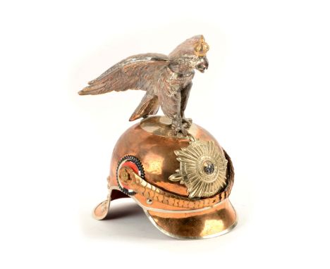 Officer's copper-alloy helmet surmounted by silver-plated eagle wearing gold crown. Scale chinstraps with two cockades. Coppe