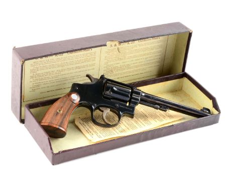 These early pre-war Smith & Wesson .22 caliber target revolvers were introduced housed in the two piece maroon hinged box wit