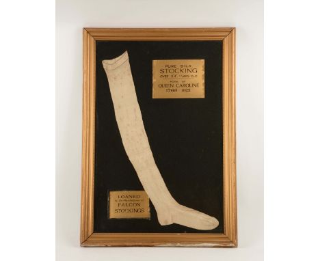 The framed stocking of Queen Caroline, consort of King George IV of Britain.  Princess Caroline of Brunswick (1768) wed Georg