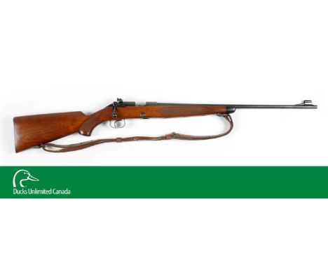 Manufactured 1953. Features round barrel, ramp front sight, no factory provision for rear sight, Redfield target receiver sig