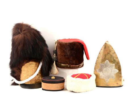 Includes a reproduction British bearskin grenadier's cap of the 1802 pattern with applied leather visor. White plume, white b