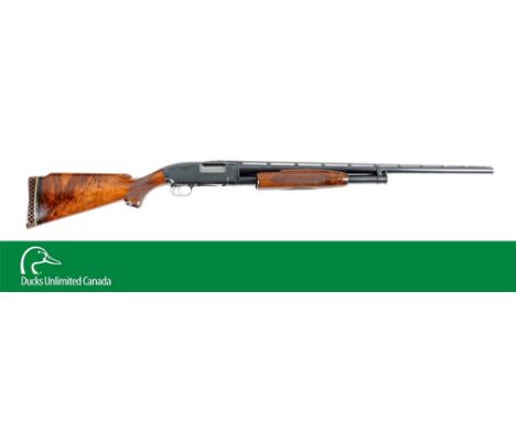 Manufactured 1961. Features full vent rib, matted, double bead, blued finish, takedown, deluxe checkered oil finish wood fore