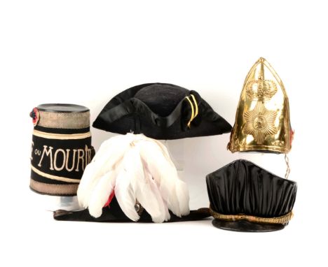 Includes a reproduction of French Revolutionary hussar's mirliton shako. Press board crown covered with black cloth band edge