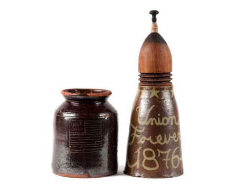 A) Mid-19th century glazed red ware crock with folk art carving of a 13 stripe American Flag and “1863 Union”.  Measures 7.5 