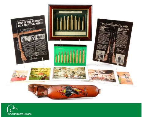 Includes large vinyl showroom sales banner, painted and tooled Weatherby/elephant shoulder strap, instruction manual for Weat