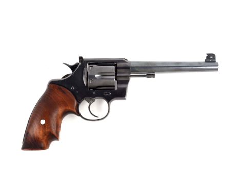 This revolver started life as a standard Colt Official Police .38 Heavy Barrel revolver.  A King stamped No. 137 sight was in