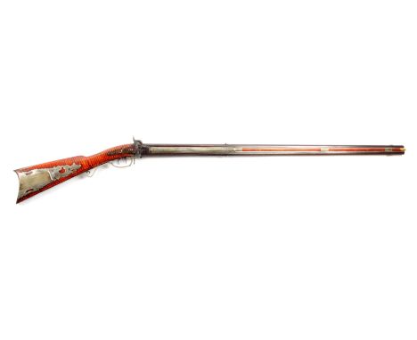 Rifled octagonal over-under barrels with silver front sights and silver ribs on each side, engraved with foliage and one side
