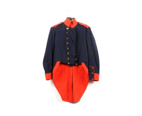 Blue wool French artillery coatee with red stand up collar, cuffs and shoulder boards. Brass flat coin button and white linin