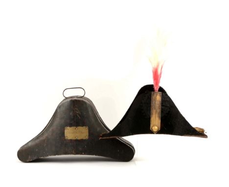 Circa 1830-50's. Black beaver chapeau with black ribbon tassels, black rosette, and gold bullion trim. One gilt button, red a