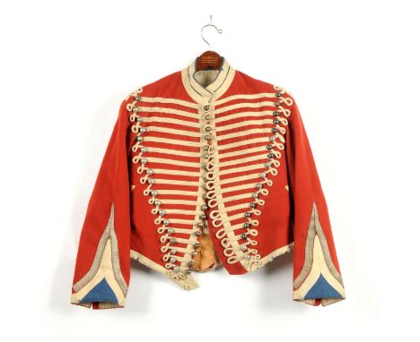 Unknown red wool dolman with white worsted cords and tape. Stand up collar. Red and blue sleeve facings with silver bullion t