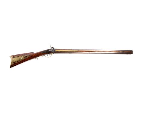 Octagonal over and under barrels, one rifled and one smoothbore, long tang with integrated rectangular silver escutcheon.  Br