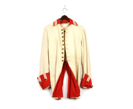 White, single breasted tail coat of cotton weave. With red "stand and fall" collar and boot cuffs. Buttons are convex brass b