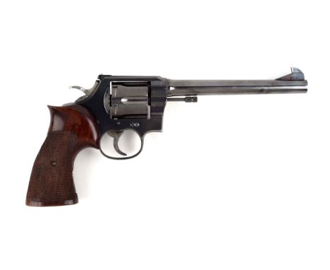 Manufactured 1927.  This revolver started out as a standard New Service six shot double action revolver with blued finish.  A