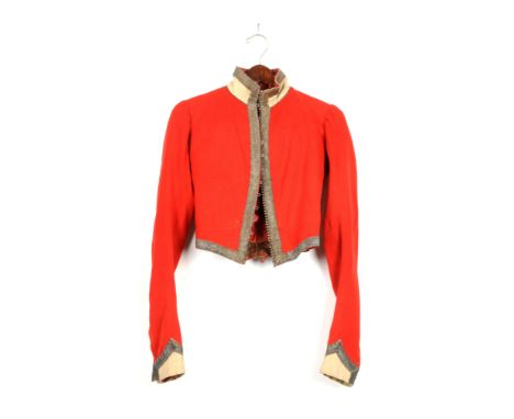 Ca. 1840. Scarlet superfine jacket, single breasted with white standing collar and pointed cuffs which is all edged with 1" w