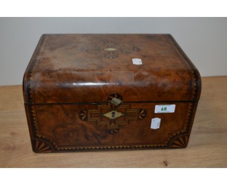 A Victorian inlaid walnut writing slope, having Mother of pearl escutcheon and geometric inlay.