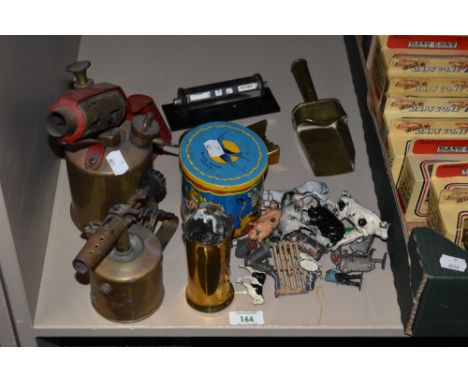A small collection of lead farm animals, including Britains, two blow torches, a vintage rotary desk calendar, and other item