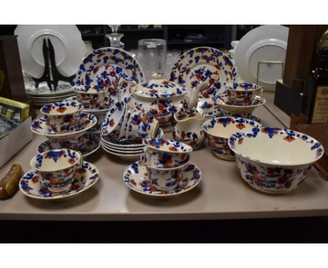 A collection of 19th Century hand painted tableware, of oriental design, and including a teapot, teacups and saucers