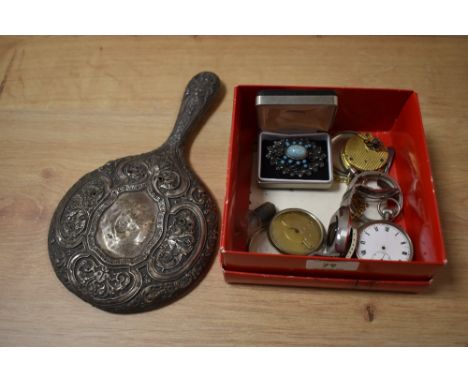 A selection of pocket watch and watch parts, a brooch and an embossed mirror handle in silver tone metal.