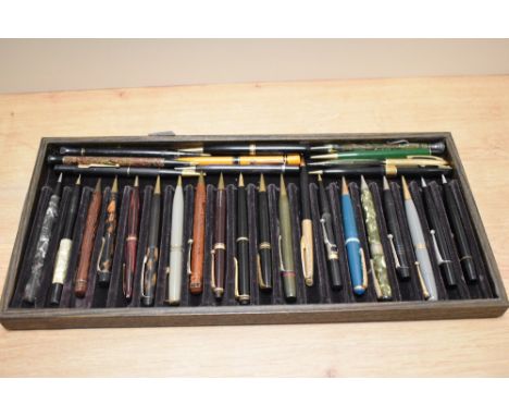 A collection of vintage retractable pencils.