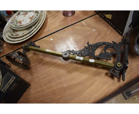 A Victorian wall light bracket, measuring 70cm long