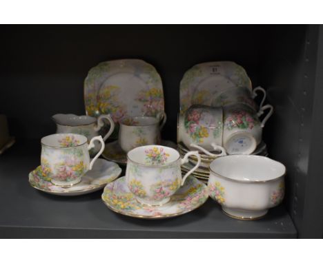 A collection of Royal Albert 'Tulip' pattern tea wares, including cups and saucers, plates, sugar basin and milk jug.