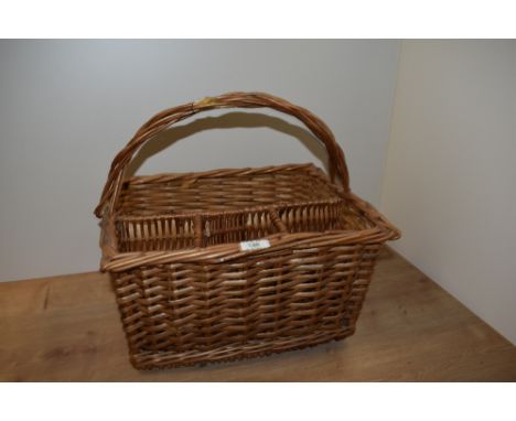A vintage wicker bottle basket, measuring 42cm x 34cm x 40cm