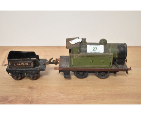 A clockwork O gauge GNR tank engine and LNWR truck.