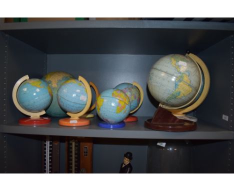 A group of mid-20th Century tinplate desk globes, by Chad Valley, and other manufacturers, the largest measures 30cm tall