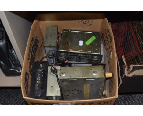 A box of vintage car radios