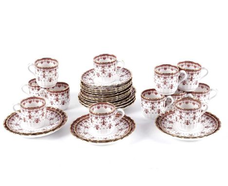 A Spode 'Fleur de Lys' pattern part tea set, in red, comprising: twelve teacups, twelve saucers, and six side plates.