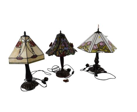 A Tiffany style table lamp, the hexagonal glass shade decorated in the manner of Charles Rennie Mackintosh, with fluted bronz