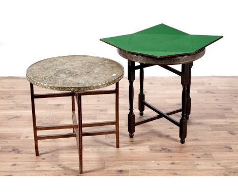 A Mosq card table, with circular brass oriental style top, the underneath with envelope fold-out leaves, revealing a green ba