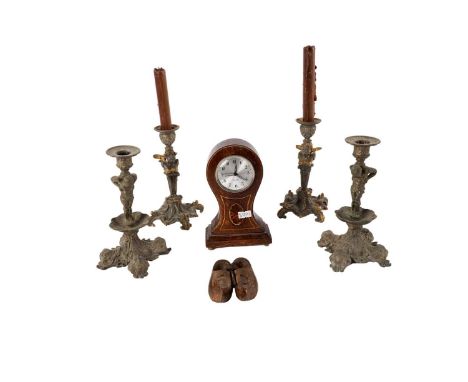 A 20th Century German miniature mantle clock, with black Arabic dial on a silver-coloured face, fitted in an inlaid oak case,