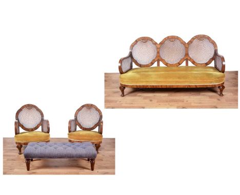 A three-piece early/mid-20th Century walnut bergère suite, comprising of: a three seater sofa, with yellow upholstered seat p
