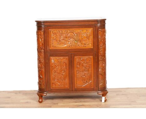 An Oriental carved hardwood drinks/cocktail cabinet, with hinged rounded rectangular top and fall flap front opening to revea