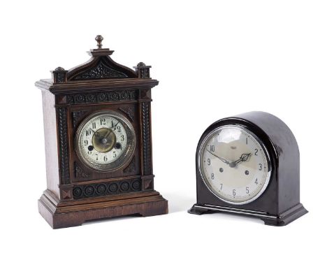 Two mantel clocks, to include: a German Edwardian mantel clock, the circular enamel dial with Arabic numerals, with a two tra