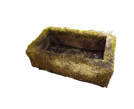 A stone composite trough garden planter, made up of one large compartment, slightly tapered form with the front being lower, 
