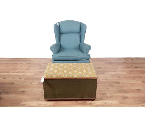 A Georgian style wingback armchair by The Carolina Sofa Factory, upholstered in a blue fabric, 81 x 75 x 100cms high; togethe