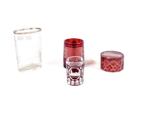 A collection of 19th Century Bohemian ruby overlay cut-glass, including: a tankard, 7.5cms, a lidded pot, and a small glass, 