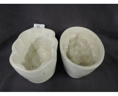Two vintage ceramic jelly moulds one impressed as a sea horse