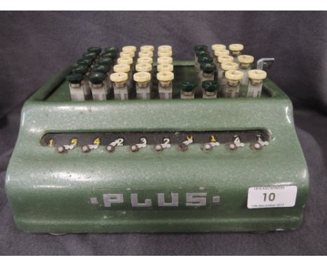 A vintage Bell Punch Plus calculating device with green enamel body 