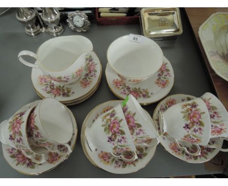 A part tea or coffee service by Colclough including jug plates cups saucers etc