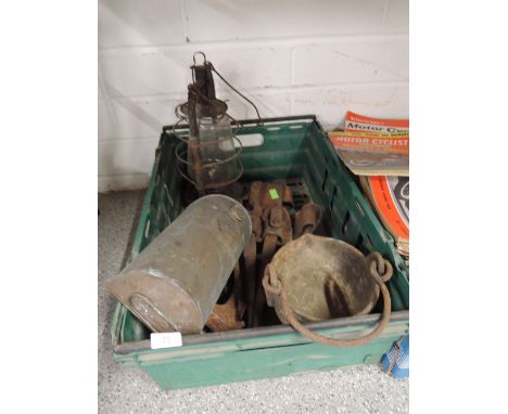 A selection of vintage rustic items including cast cauldron storm lantern and spanner belt 