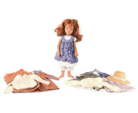 Sasha Doll - an original vintage 1970s vinyl Sasha doll with a quantity of additional handmade clothing. The doll with hand p