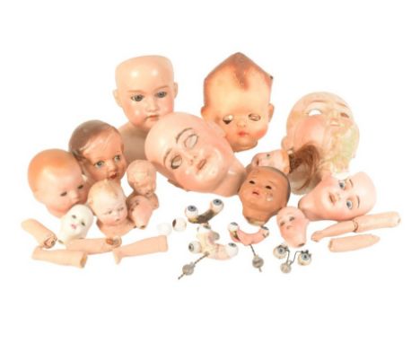 Dolls - a collection of vintage French and German bisque heads and glass eyes for dolls to include Armand Marseille, Limoges,