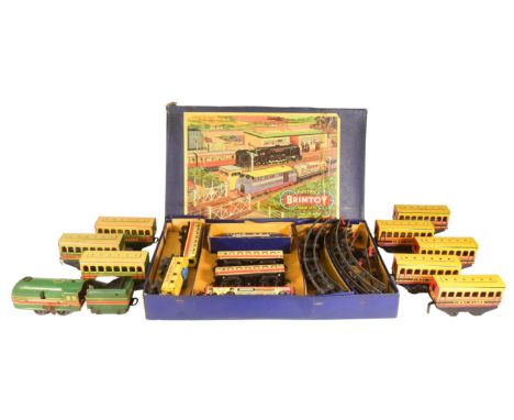 Model Railway - x2 vintage Brimtoy made tinplate model railway trainsets comprising a boxed electric example with loco, x2 pa