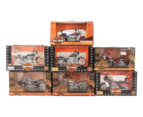 Diecast - a collection of Maisto and ERTL 1/18 scale boxed diecast Harley Davidson motorcycle models to include; 2004 Heritag