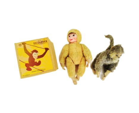 A collection of vintage mechanical and soft toys comprising x2 Russian made tumbling monkeys with box, Schuco mohair monkey w