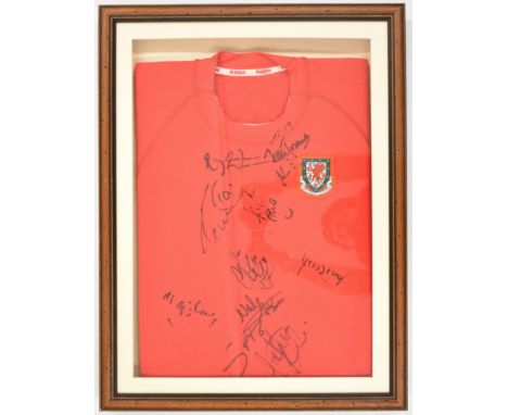 Wales retro home shirt signed by eleven of the football team including Ian Rush, housed in box frame, 54 x 38cm