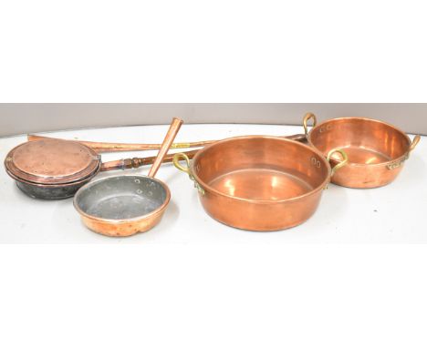 Two 19thC copper jam pans, frying pan and warmer, all with riveted handles, largest diameter 44cm